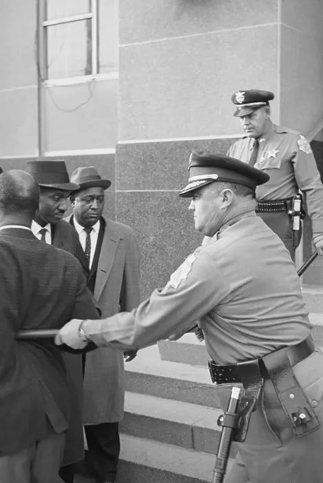 Framed Print : Policeman Prodding African-American Framed Print : Policeman Prodding African-American