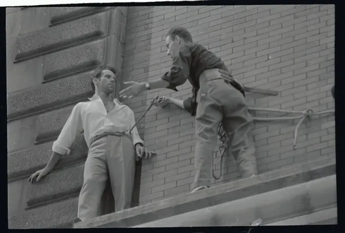 Framed Print : Policeman Rescuing Man on Ledge Framed Print : Policeman Rescuing Man on Ledge