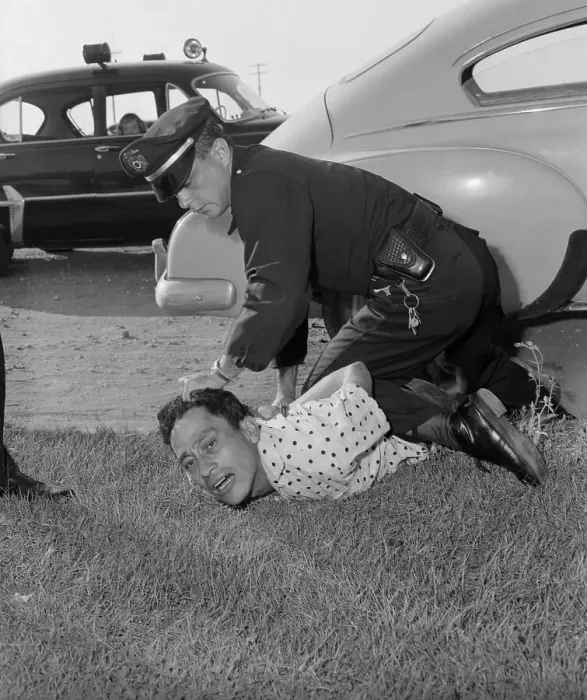 Framed Print : Policeman Restraining Suspect Framed Print : Policeman Restraining Suspect