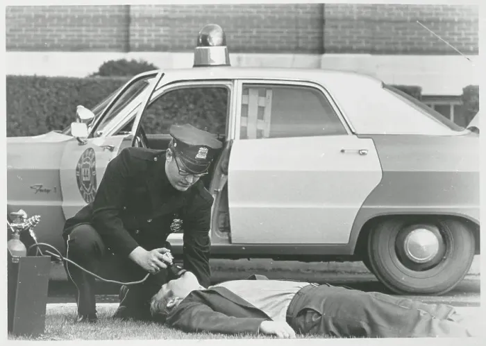 Framed Print : Policeman Reviving Heart Attack Victim Framed Print : Policeman Reviving Heart Attack Victim