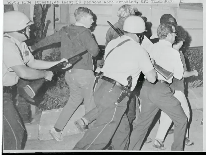 Framed Print : Policemen with Guns Arresting Youth Protesters Framed Print : Policemen with Guns Arresting Youth Protesters