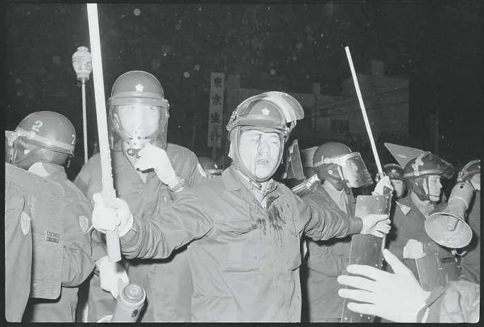 Framed Print : Policemen in Riot Gear Restraining Crowd Framed Print : Policemen in Riot Gear Restraining Crowd