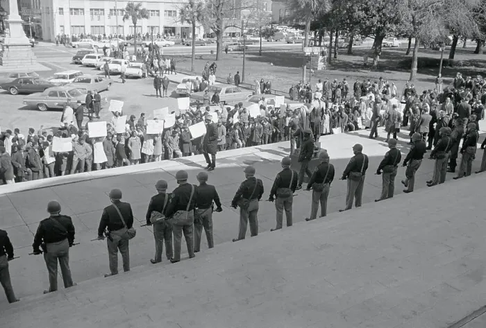Framed Print : Policemen Watching Demonstrators Framed Print : Policemen Watching Demonstrators