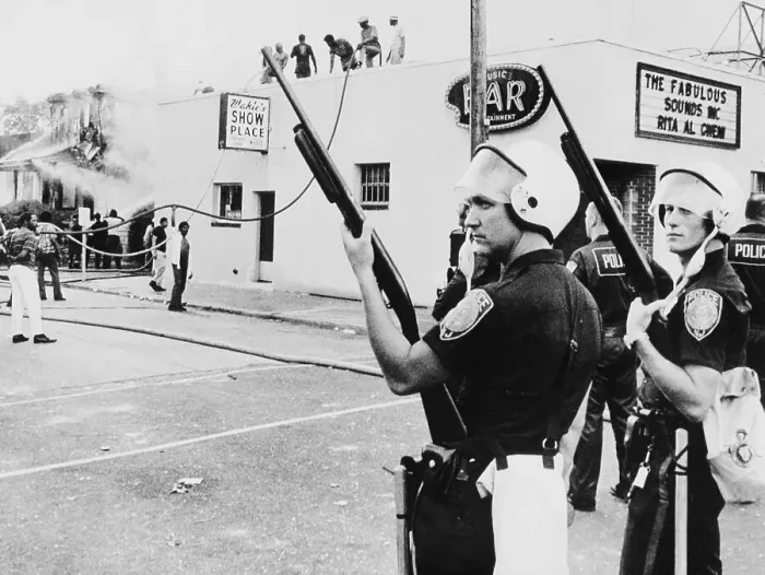 Framed Print : Policemen Watching People Extinguish a Fire Framed Print : Policemen Watching People Extinguish a Fire