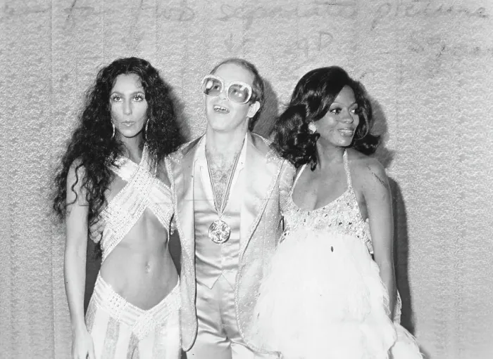 Framed Print : Divas. CIRCA 1975: Pop singers Cher, Elton John Framed Print : Divas. CIRCA 1975: Pop singers Cher, Elton John