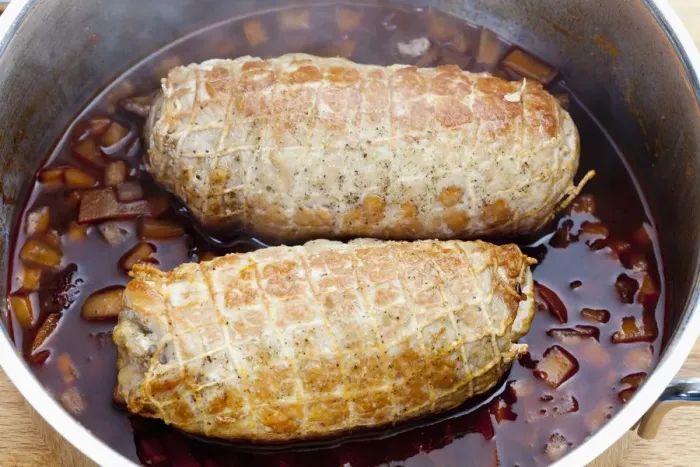 Framed Print : Pork roulade in a net in a casserole pot Framed Print : Pork roulade in a net in a casserole pot