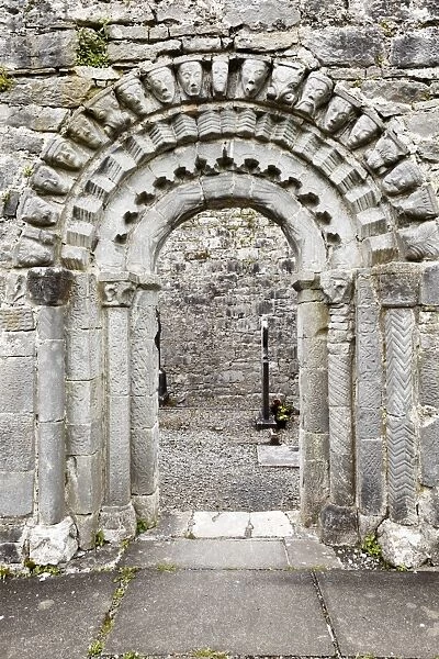 Portal with faces of stone, Dysert O Dea church ruins near Corofin, County Clare, Ireland, Europe