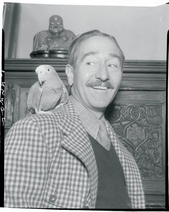 Framed Print : Portrait of Adolphe Menjou With His Parrot Framed Print : Portrait of Adolphe Menjou With His Parrot