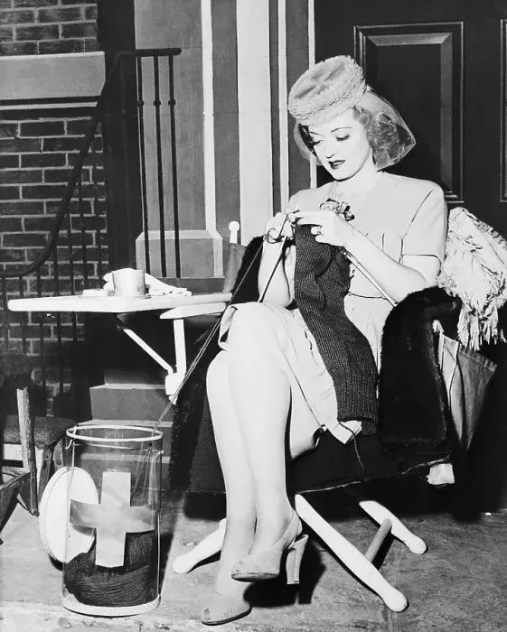 Framed Print : Portrait of Bette Davis Knitting Sweaters