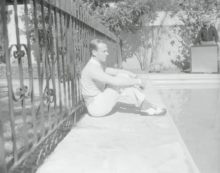 Framed Print : Portrait of Fred Astaire Sitting at Poolside