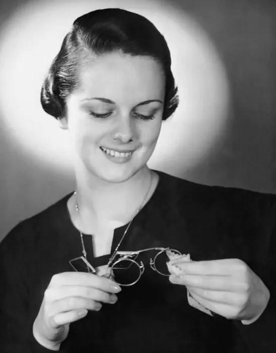 Framed Print : Portrait of woman cleaning eyeglasses Framed Print : Portrait of woman cleaning eyeglasses