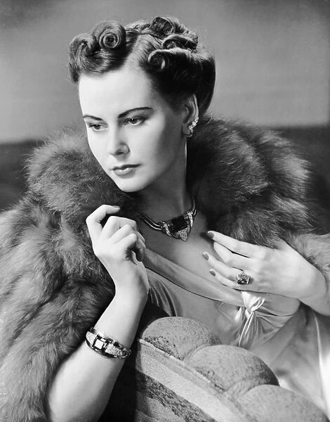 Portrait of woman wearing jewelry & fur coat
