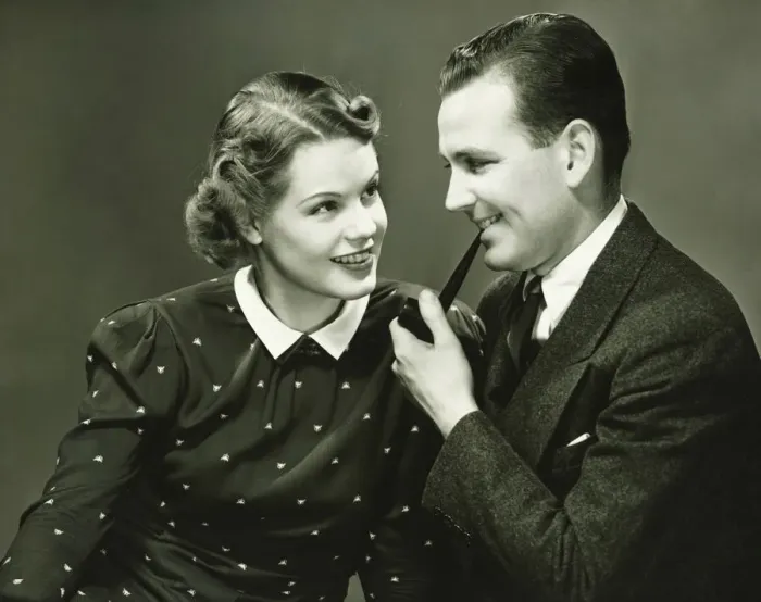 Framed Print : Portrait of young couple, man holding pipe, smiling, (Portrait) Framed Print : Portrait of young couple, man holding pipe, smiling, (Portrait)