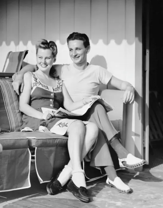 Framed Print : Portrait of young couple sitting outdoors Framed Print : Portrait of young couple sitting outdoors