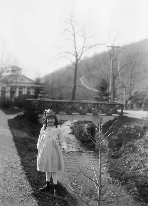 Framed Print : Portrait of young girl (8-9 years) holding tree branch by stream. April 14, 1922 Framed Print : Portrait of young girl (8-9 years) holding tree branch by stream. April 14, 1922
