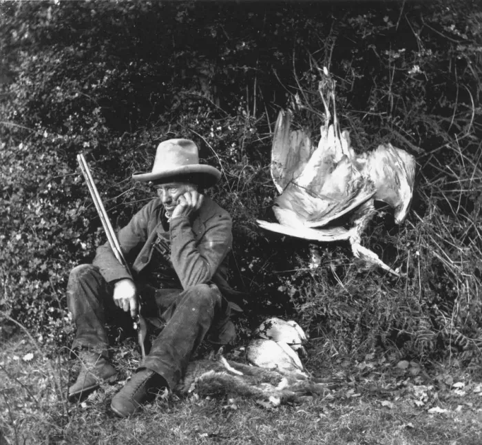 Framed Print : Pot Shot. circa 1857: A hunter with his catch of rabbits and birds