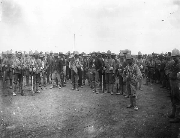 POW Camp. circa 1900: The Cornwall Regiment in charge of Boer prisoners at Dunnyside