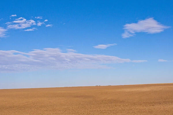 Prairie landscape under blue sky with white clouds, Omaha, Nebraska, USA
