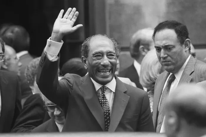 Framed Print : President Anwar Sadat Waves to Crowd Framed Print : President Anwar Sadat Waves to Crowd