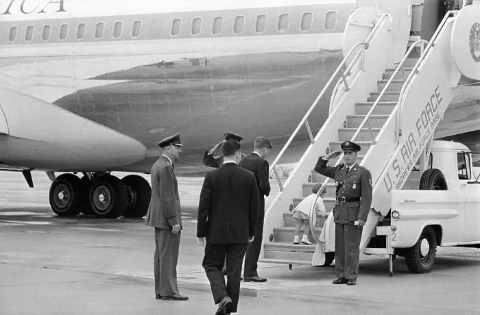Framed Print : President Kennedy Watching Son Climb Steps of Plane Framed Print : President Kennedy Watching Son Climb Steps of Plane
