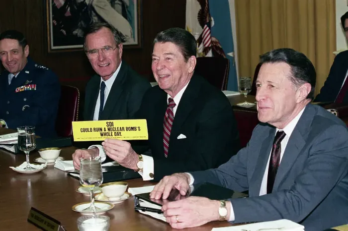 Framed Print : President Reagan Holding Up Bumper Sticker During Meeting Framed Print : President Reagan Holding Up Bumper Sticker During Meeting