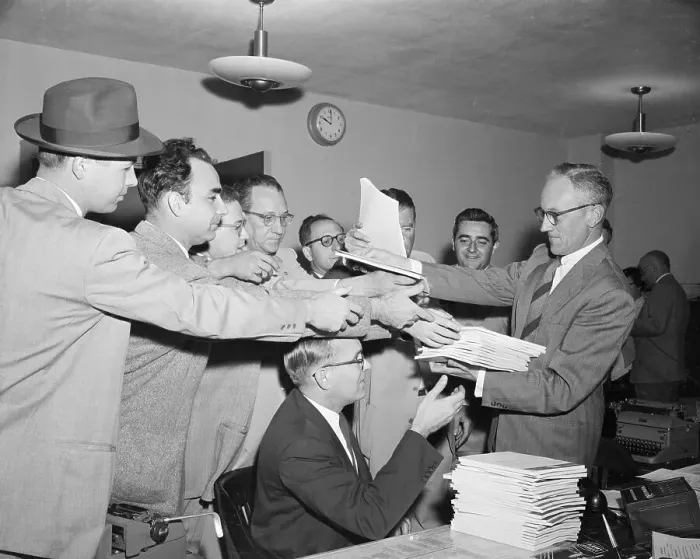 Framed Print : Press Officer Distributing Documents to Reporters Framed Print : Press Officer Distributing Documents to Reporters