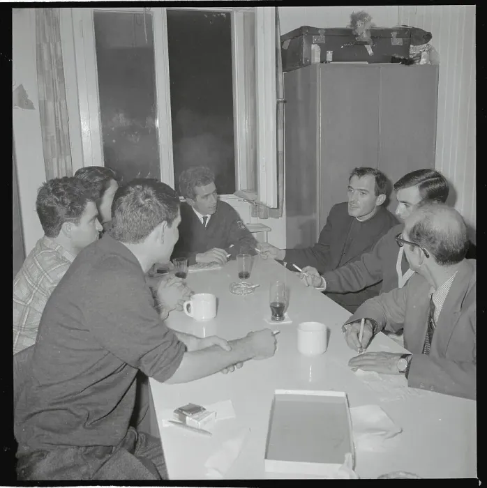 Framed Print : Priest and Guest Workers Having Informal Meeting Framed Print : Priest and Guest Workers Having Informal Meeting