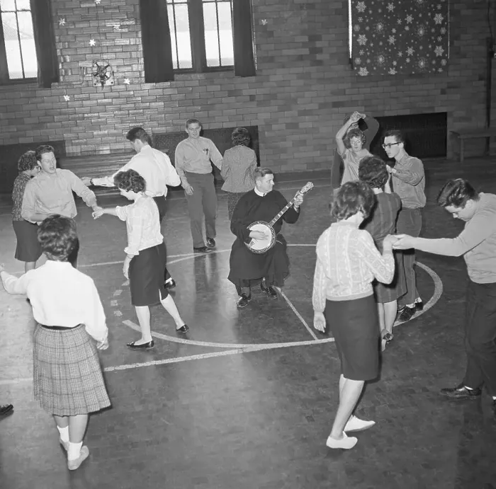 Framed Print : Priest Playing the Banjo at Student Dance