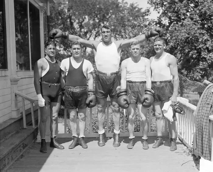 Framed Print : Primo Carnera Stands with Sparring Partners