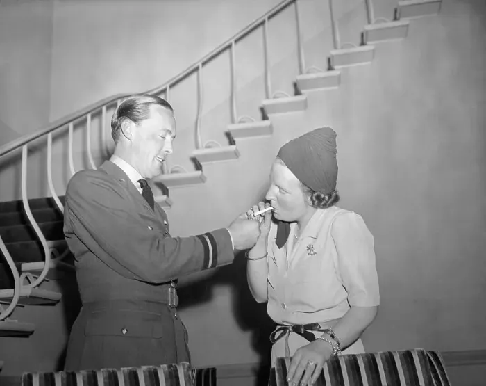 Framed Print : Prince Bernhard Lighting Cigarette for Princess Juliana Framed Print : Prince Bernhard Lighting Cigarette for Princess Juliana