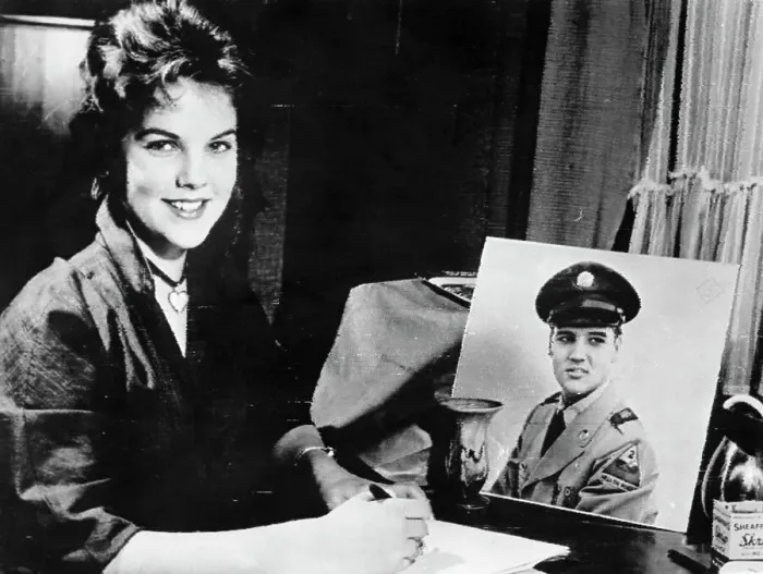 Framed Print : Priscilla Beaulieu with Portrait of Elvis Presley