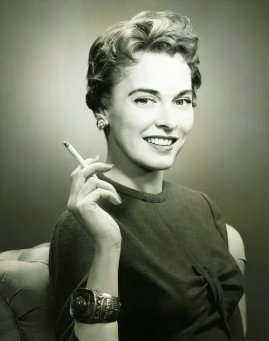 Framed Print : Profile of smiling woman holding cigarette, (B&W), portrait Framed Print : Profile of smiling woman holding cigarette, (B&W), portrait