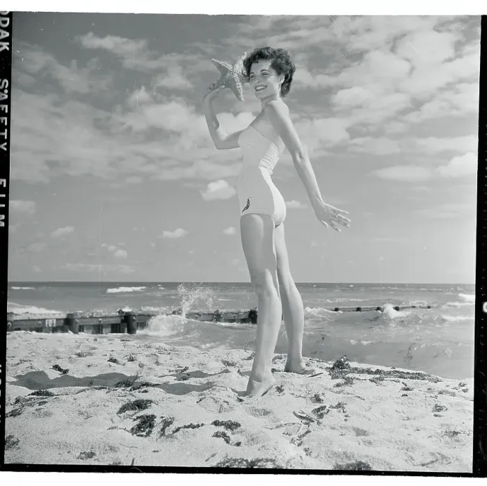 Framed Print : Profile of Young Woman Posing with Starfish in Hand Framed Print : Profile of Young Woman Posing with Starfish in Hand