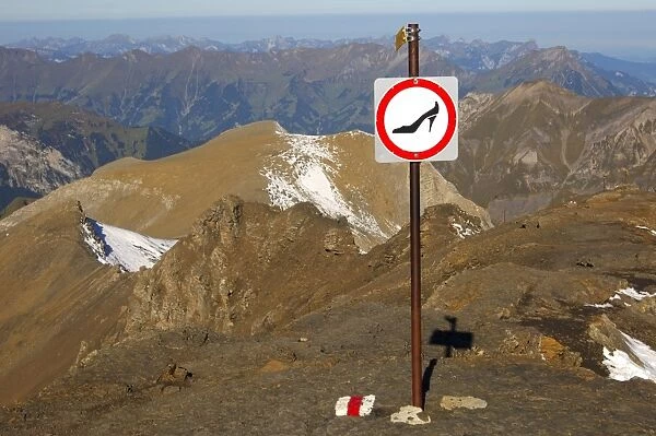 Prohibition sign for use of the mountain trail with unsuitable footwear on Schilthorn Mountain, Muerren, Bernese Oberland, Switzerland, Europe