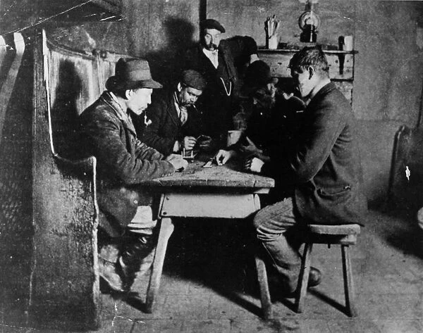Pub Games. circa 1860: Dominoes and cribbage being played in an old English tavern
