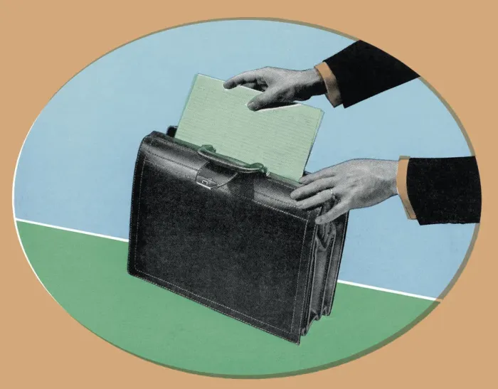 Framed Print : Putting Papers in a Briefcase