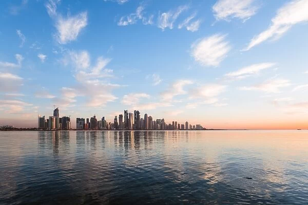 Qatar, Doha. Skyline at sunrise from the Corniche