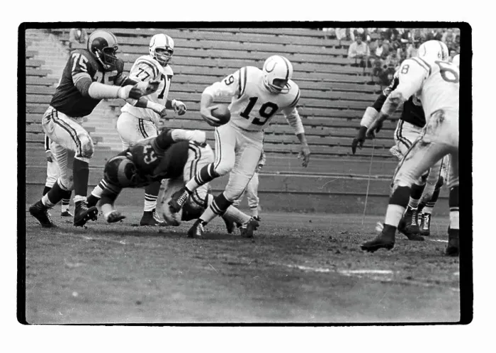 Framed Print : Quarterback Johnny Unitas Runs Through the Rams Defense Framed Print : Quarterback Johnny Unitas Runs Through the Rams Defense