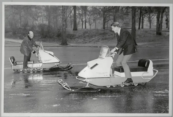 Framed Print : Race Car Drivers Riding Snowmobiles Framed Print : Race Car Drivers Riding Snowmobiles
