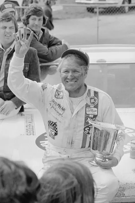 Framed Print : Racer Gale Yarborough Holding Trophy in Victory Pose Framed Print : Racer Gale Yarborough Holding Trophy in Victory Pose