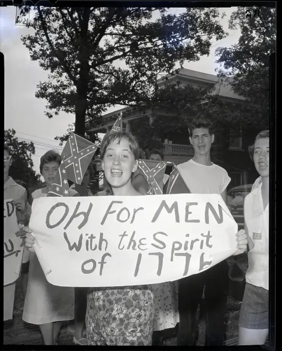 Framed Print : Racist Holds Anti-Integration Sign Framed Print : Racist Holds Anti-Integration Sign