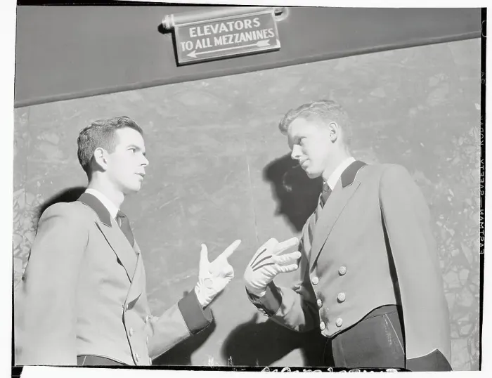 Framed Print : Two Radio City Music Hall Ushers Speaking with Signals Framed Print : Two Radio City Music Hall Ushers Speaking with Signals