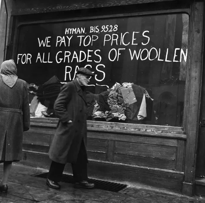 Framed Print : Rag Shop. An elderly man walks past a shop window announcing we pay top Framed Print : Rag Shop. An elderly man walks past a shop window announcing we pay top