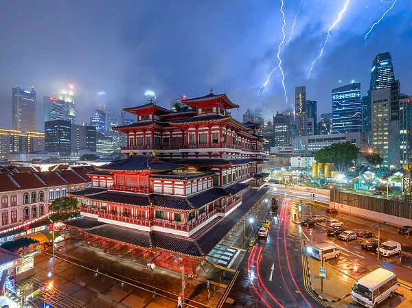 Raikou. Lightning storm over Buddhas Tooth Relic Temple in Chinatown during