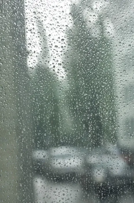Framed Print : Rain drops on a window pane, blurry buildings and cars in the back Framed Print : Rain drops on a window pane, blurry buildings and cars in the back