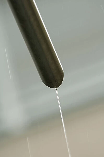 Rain water flowing from a drain pipe