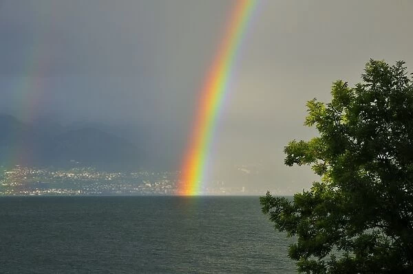 Rainbow on the shore at Lausanne, Switzerland, from France, Lake Geneva, Lac Leman, Evian-les-Bains, Haute-Savoie, Rhone-Alpes, France