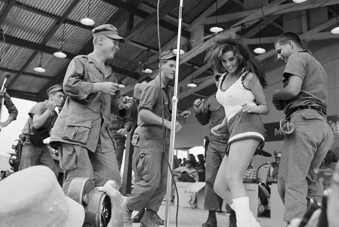 Framed Print : Raquel Welch Dancing with Soldiers Framed Print : Raquel Welch Dancing with Soldiers