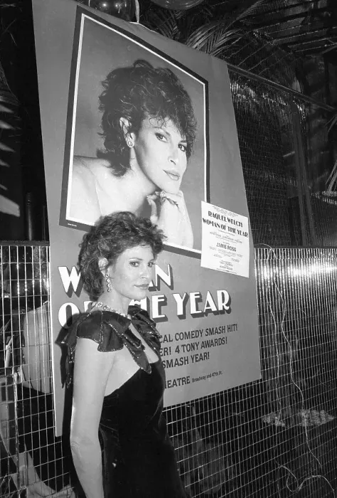 Framed Print : Raquel Welch Stands in Front of Poster Framed Print : Raquel Welch Stands in Front of Poster