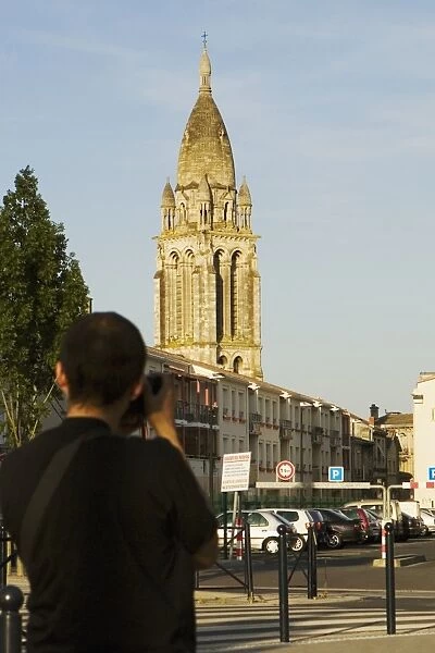 Rear view of a man photographing a church, Leglise Sainte-Marie De La Bastide, Bordeaux, Aquitaine, France